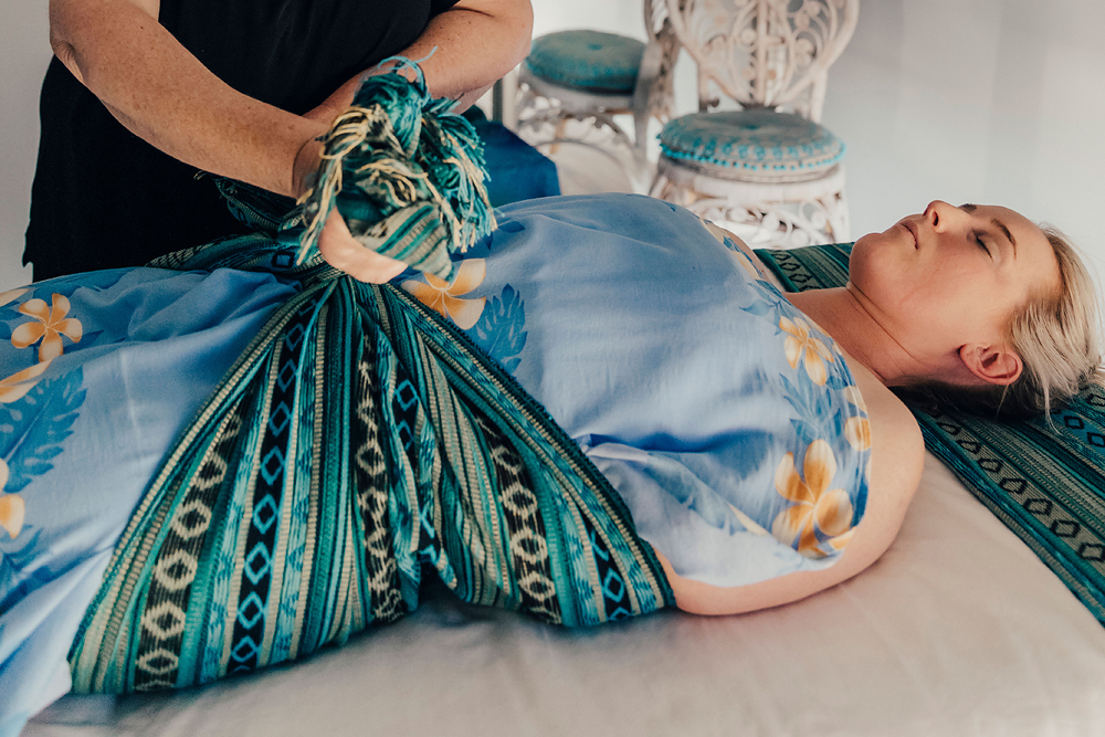 Woman lying down with abdominal wrapping